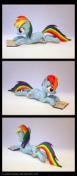 Size: 1700x3900 | Tagged: safe, artist:clawed-nyasu, derpibooru import, rainbow dash, 3d print, book, irl, photo, reading rainboom, solo