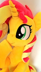 Size: 576x1024 | Tagged: safe, artist:nekokevin, sunset shimmer, pony, unicorn, boop, cute, female, irl, lying down, mare, photo, plushie, raised hoof, self-boop, shimmerbetes, shimmerposting, smiling, solo, underhoof