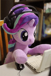 Size: 200x300 | Tagged: safe, alternate version, artist:nekokevin, starlight glimmer, pony, unicorn, series:nekokevin's glimmy, animated, chair, computer, computer mouse, cute, female, gif, glimmerbetes, headphones, irl, laptop computer, looking down, mare, multicolored mane, photo, plushie, shaking, smiling, solo, stop motion