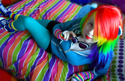 Size: 1024x666 | Tagged: safe, artist:amphyrainbows, rainbow dash, human, bed, cosplay, irl, irl human, looking at you, photo, solo