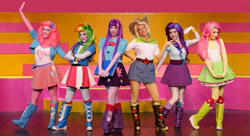 Size: 1019x555 | Tagged: safe, derpibooru import, applejack, fluttershy, pinkie pie, rainbow dash, rarity, twilight sparkle, human, equestria girls, actress, boots, clothes, compression shorts, cosplay, costume, denim skirt, eqg el show en vivo, irl, irl human, live action, mane six, photo, pleated skirt, shorts, skirt, theater