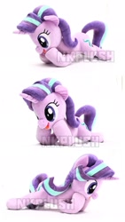 Size: 1151x2048 | Tagged: safe, artist:nekokevin, starlight glimmer, pony, unicorn, series:nekokevin's glimmy, female, irl, lying down, mare, open mouth, photo, plushie, raised hoof, simple background, smiling, triality, watermark, white background