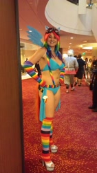 Size: 1082x1920 | Tagged: safe, artist:salaciouseos, rainbow dash, human, arm warmers, armpits, artifact, belly button, belt, bikini, clothes, cosplay, cutie mark, dragoncon, goggles, high heels, irl, irl human, leg warmers, photo, rainbow socks, socks, striped socks, suspenders, swimsuit