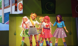 Size: 1088x650 | Tagged: safe, derpibooru import, applejack, fluttershy, pinkie pie, rainbow dash, rarity, human, equestria girls, rainbow rocks, actress, boots, clothes, cowboy hat, denim skirt, hat, irl, irl human, live action, performance, photo, singapore, skirt, stetson, the mlp musical: rainbow rocks