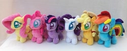 Size: 970x387 | Tagged: safe, artist:lilmoon, derpibooru import, applejack, fluttershy, pinkie pie, rainbow dash, rarity, twilight sparkle, twilight sparkle (alicorn), alicorn, pony, chibi, cute, irl, mane six, photo, plushie, watermark