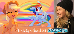 Size: 1600x749 | Tagged: safe, artist:meekcheep, derpibooru import, applejack, rainbow dash, earth pony, human, pegasus, pony, ashleigh ball, clothes, equestria daily, eyes closed, hat, hooves up, irl, photo, ponycon, rainbow, raised hoof, speed lines