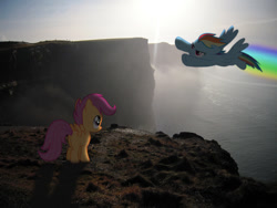 Size: 990x743 | Tagged: safe, rainbow dash, scootaloo, pegasus, pony, cliff, flying, ocean, photoshop, sunset