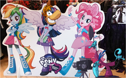 Size: 976x606 | Tagged: safe, derpibooru import, edit, pinkie pie, rainbow dash, twilight sparkle, human, equestria girls, book, equestria girls plus, face cutout, irl, irl human, logo, photo, rayman