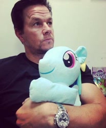 Size: 494x598 | Tagged: safe, derpibooru import, rainbow dash, human, pegasus, pony, duo, female, irl, irl human, mare, mark wahlberg, my little pony logo, photo, plushie, watch