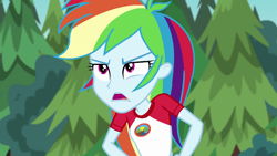 Size: 1280x720 | Tagged: safe, derpibooru import, screencap, rainbow dash, equestria girls, legend of everfree, camp everfree outfits, clothes, female, hand on hip, open mouth, tree