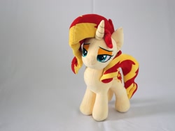 Size: 3000x2250 | Tagged: safe, artist:nekokevin, sunset shimmer, pony, unicorn, female, irl, lidded eyes, mare, photo, plushie, simple background, smiling, solo, white background