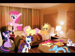 Size: 1024x768 | Tagged: safe, derpibooru import, apple bloom, applejack, fluttershy, pinkie pie, rainbow dash, rarity, scootaloo, sweetie belle, twilight sparkle, bed, cutie mark crusaders, hotel, irl, mane six, photo, ponies in real life