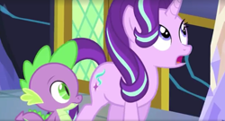 Size: 1412x762 | Tagged: safe, screencap, spike, starlight glimmer, dragon, pony, unicorn, the crystalling, blue eyes, cutie mark, door, fangs, female, green eyes, hair flip, horn, male, mare, scales, talking, twilight's castle