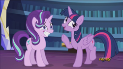 Size: 1280x720 | Tagged: safe, screencap, starlight glimmer, twilight sparkle, twilight sparkle (alicorn), alicorn, pony, the crystalling, discovery family logo, female, library, mare, nervous grin