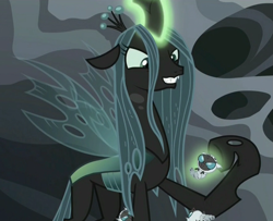 Size: 1319x1071 | Tagged: safe, screencap, queen chrysalis, changeling, changeling larva, changeling queen, the times they are a changeling, female, glare, grin, grub, levitation, magic, smiling, smirk, telekinesis