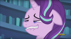 Size: 1413x778 | Tagged: safe, screencap, starlight glimmer, pony, unicorn, the crystalling, blue eyes, book, bookshelf, discovery family, discovery family logo, faic, female, floppy ears, horn, lip bite, mare, nervous, out of context, solo, teeth, twilight's castle, unf, watermark