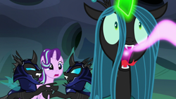 Size: 1280x720 | Tagged: safe, screencap, queen chrysalis, starlight glimmer, changeling, changeling queen, pony, unicorn, to where and back again, armor, changeling feeding, changeling guard, creepy, female, glowing horn, helmet, magic, mare