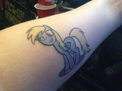 Size: 600x449 | Tagged: safe, derpy hooves, pegasus, pony, female, mare, photo, tattoo