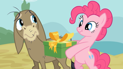 Size: 500x281 | Tagged: safe, screencap, cranky doodle donkey, pinkie pie, donkey, earth pony, pony, a friend in deed, astartes pattern baldness, bipedal, duo, hoof hold, present, scrunchy face