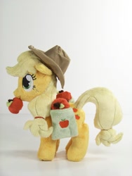 Size: 1024x1365 | Tagged: safe, artist:eebharas, applejack, pony, accessories, apple, irl, mini, obligatory apple, photo, plushie, saddle bag, solo