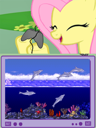 Size: 748x1001 | Tagged: safe, fluttershy, pegasus, pony, controller, ecco the dolphin, exploitable meme, eyes closed, female, gamershy, happy, hoof hold, mare, meme, open mouth, pink mane, screen, smiling, this will end in tears, tv meme, yellow coat