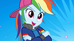 Size: 1280x720 | Tagged: safe, derpibooru import, screencap, rainbow dash, eqg summertime shorts, equestria girls, get the show on the road, backwards ballcap, baseball cap, cap, clothes, crossed arms, female, hat, open mouth, rapper dash, solo