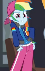Size: 457x720 | Tagged: safe, derpibooru import, screencap, rainbow dash, eqg summertime shorts, equestria girls, get the show on the road, backwards ballcap, baseball cap, cap, clothes, cropped, hand on hip, hat, jacket, pants, rapper dash, sexy, smiling, zoomed in
