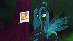 Size: 1280x720 | Tagged: safe, screencap, applejack, queen chrysalis, changeling, changeling queen, earth pony, pony, the mean 6, female, hair, hoof on chest, photo, picture, solo, tree