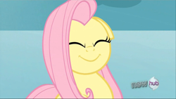 Size: 1024x577 | Tagged: safe, edit, edited screencap, screencap, fluttershy, pegasus, pony, keep calm and flutter on, angry, constipated, eyes closed, faic, floppy ears, flutterfrown, hub logo, inverted mouth, smiling, solo