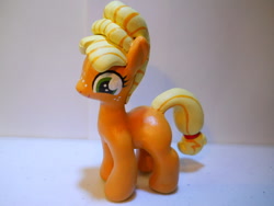 Size: 1024x768 | Tagged: safe, artist:earthenpony, applejack, alternate hairstyle, custom, filly, irl, manehattan, orangejack, photo, scene interpretation, sculpture, solo, toy