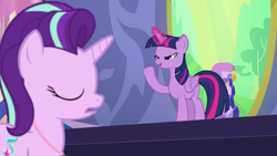 Size: 1280x720 | Tagged: safe, screencap, starlight glimmer, twilight sparkle, twilight sparkle (alicorn), alicorn, pony, unicorn, celestial advice, animation error, equestrian pink heart of courage, eyes closed, glowing horn, lidded eyes, magic, open mouth, raised hoof, smiling, twilight's castle