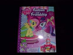 Size: 4608x3456 | Tagged: safe, fluttershy, rarity, spike, dragon, pegasus, pony, unicorn, book, fashion and friendship, merchandise, papercraft