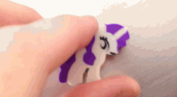 Size: 640x352 | Tagged: safe, artist:viva reverie, rarity, animated, eraser, gif, immatoonlink, irl, meet rarity, nightmare fuel, photo, reaction image, rubber, solo, wat, why the long face