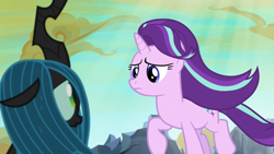 Size: 1280x720 | Tagged: safe, screencap, queen chrysalis, starlight glimmer, changeling, changeling queen, pony, unicorn, to where and back again, changeling hive, cloud, duo, female, mare, ruins, sunlight, windswept mane
