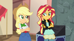 Size: 1280x718 | Tagged: safe, screencap, applejack, sunset shimmer, equestria girls, movie magic, spoiler:eqg specials, >:d, clothes, cowboy hat, crossed arms, denim skirt, evil grin, freckles, grin, hat, jacket, leather jacket, looking at each other, pants, skirt, smiling, smirk, stetson