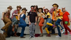 Size: 2048x1169 | Tagged: artist needed, safe, apple bloom, applejack, big macintosh, braeburn, human, cosplay, cowboy vest, group photo, irl, irl human, london mcm expo, london mcm oct 2012 expo, overalls, photo, suspenders