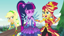 Size: 1280x720 | Tagged: safe, screencap, applejack, sci-twi, sunset shimmer, twilight sparkle, equestria girls, legend of everfree, alternate hairstyle, clothes, crystal guardian, crystal wings, gloves, log, open mouth, pants, super strength