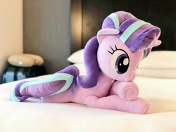 Size: 1024x768 | Tagged: safe, artist:nekokevin, starlight glimmer, pony, unicorn, series:nekokevin's glimmy, bed, crossed hooves, cute, female, glimmerbetes, irl, lying down, mare, photo, plushie, prone, smiling, solo, underhoof