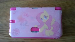 Size: 7712x4352 | Tagged: safe, fluttershy, pegasus, pony, 3ds, 3ds xl, absurd resolution, case, merchandise, solo