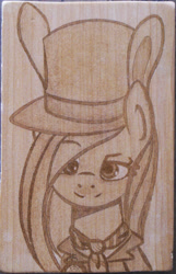 Size: 1394x2165 | Tagged: safe, artist:augustbebel, fluttershy, alice in wonderland, bunny ears, crossover, hat, irl, mad hatter, photo, pyrography, solo, traditional art, woodwork