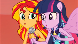 Size: 1366x768 | Tagged: safe, screencap, sunset shimmer, twilight sparkle, equestria girls, rainbow rocks, 8^y, faic, happy, microphone, ooh, ponied up, smiling, spread wings, wings