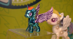 Size: 844x458 | Tagged: safe, princess celestia, rainbow dash, alicorn, pegasus, pony, metal, official, spread wings, toy, wingding eyes, wings