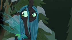 Size: 1136x640 | Tagged: safe, screencap, queen chrysalis, changeling, changeling queen, frenemies (episode), female, looking back, smug, snow, solo, tree