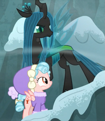 Size: 507x583 | Tagged: safe, screencap, cozy glow, queen chrysalis, changeling, changeling queen, pegasus, pony, frenemies (episode), clothes, cropped, duo, female, filly, foal, hat, wind, winter outfit