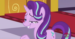 Size: 860x449 | Tagged: safe, screencap, starlight glimmer, pony, unicorn, a royal problem, canterlot castle, carpet, cutie mark, derp, faic, female, grin, hair flip, horn, lidded eyes, raised hoof, smiling, solo, treehouse logo, watermark