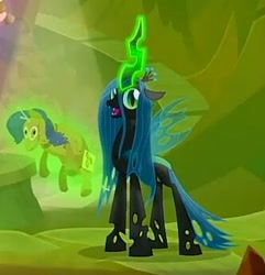 Size: 332x344 | Tagged: safe, screencap, queen chrysalis, changeling, changeling queen, frenemies (episode), cropped, female, glowing horn, happy, horn, magic, rarity plushie, solo, telekinesis