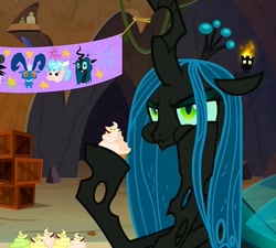 Size: 697x626 | Tagged: safe, screencap, cozy glow, grogar, lord tirek, queen chrysalis, changeling, changeling queen, pegasus, pony, frenemies (episode), annoyed, banner, cropped, cupcake, cute, cutealis, eating, female, food, puffy cheeks, solo