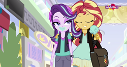 Size: 1364x724 | Tagged: safe, screencap, starlight glimmer, sunset shimmer, equestria girls, mirror magic, spoiler:eqg specials, bag, beanie, clothes, eating, face, food, geode of empathy, hat, hug, ice cream, ice cream cone, lidded eyes, magical geodes, messy eating, teletoon, thick, wat, wide hips