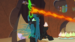 Size: 1920x1080 | Tagged: safe, screencap, queen chrysalis, changeling, changeling queen, frenemies (episode), cupcake, eating, female, food, glowing horn, hoof hold, horn, magic drain, solo