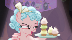 Size: 1920x1080 | Tagged: safe, screencap, cozy glow, grogar, lord tirek, queen chrysalis, changeling, changeling queen, pegasus, pony, frenemies (episode), cupcake, female, filly, foal, food, narrowed eyes, solo, stack